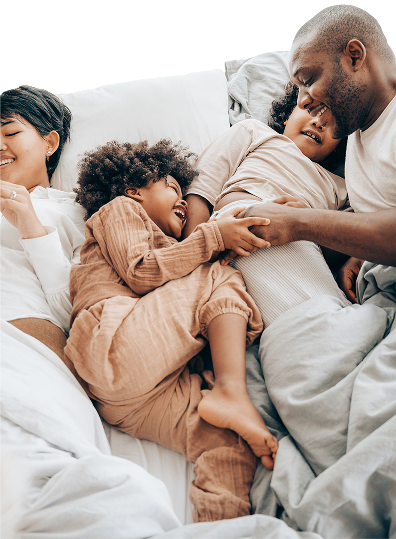A happy family in bed
